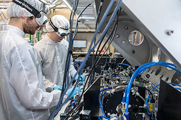 Researchers in PPE in a lab